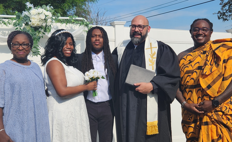 Our Lead Officiant Ashton Bishop with one of his couples and their family.