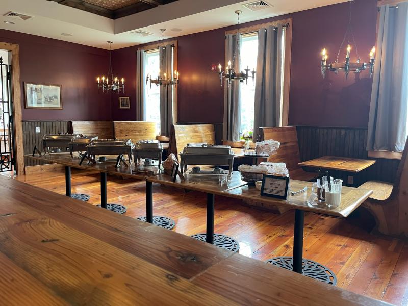 The reclaimed booths are made even more special with custom-built tables, ideal for serving up a buffet of delights.