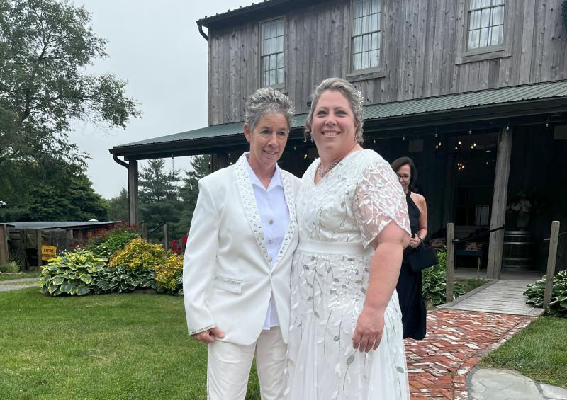Couple heading down to ceremony pavilion to get married